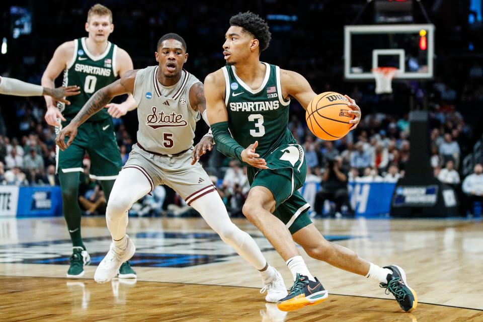 Michigan State guard Jaden Akins (3) dribbles against Mississippi State guard Shawn Jones Jr. (5) during the first half of NCAA tournament West Region first round at Spectrum Center in Charlotte, N.C. on Thursday, March 21, 2024.