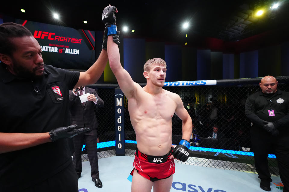 LAS VEGAS, NEVADA - OCTOBER 29:  Arnold Allen of England celebrates his victory over Calvin Kattar in a featherweight fight during the UFC Fight Night event at UFC APEX on October 29, 2022 in Las Vegas, Nevada. (Photo by Jeff Bottari/Zuffa LLC)