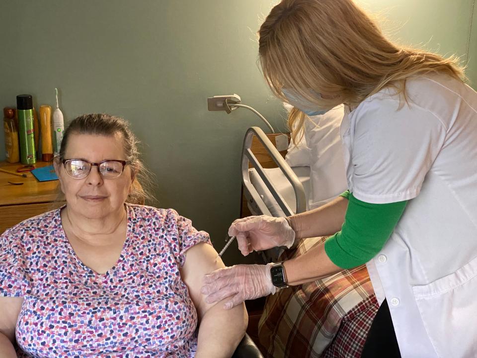 Joyce Sack, a resident of Bayberry Nursing Home in New Rochelle, receives a COVID vaccine on Tuesday, Dec. 29, 2020.