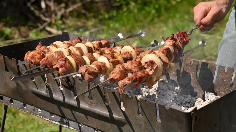 meat kebabs on charcoal grill