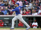 Chicago Cubs' Ian Happ watches his RBI-double against the Cincinnati Reds during the fourth inning of a baseball game in Cincinnati, Monday, May 23, 2022. (AP Photo/Paul Vernon)