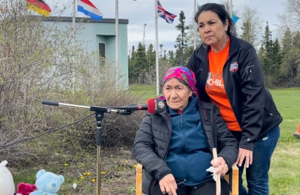 Innu Elder Elizabeth Penashue, seated, and her daughter Kanani Davis spoke at Monday's memorial.