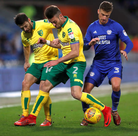 Soccer Football - Championship - Cardiff City vs Norwich City - Cardiff City Stadium, Cardiff, Britain - December 1, 2017 Cardiff City's Joe Bennett in action with Norwich City's Wesley Hoolahan and Ivo Pinto Action Images/Peter Cziborra