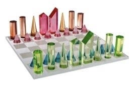 Chess set with clear and solid geometric pieces