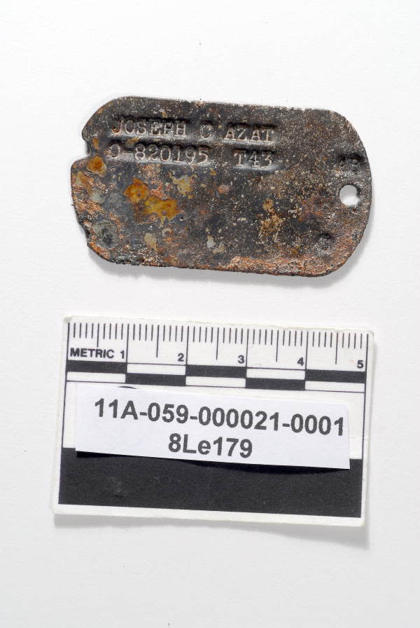 While excavating the cistern at The Grove in Tallahassee, workers retrieved bottles and old toys. One intriguing item found was Lt. Joseph Azat’s dog tag, service # 0-820195.