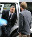 Oscar Pistorius arrives at the high court in Pretoria, South Africa, Wednesday, April 16, 2014. Pistorius is charged with murder for the shooting death of his girlfriend Reeva Steenkamp on Valentine's Day in 2013. (AP Photo/Themba Hadebe)