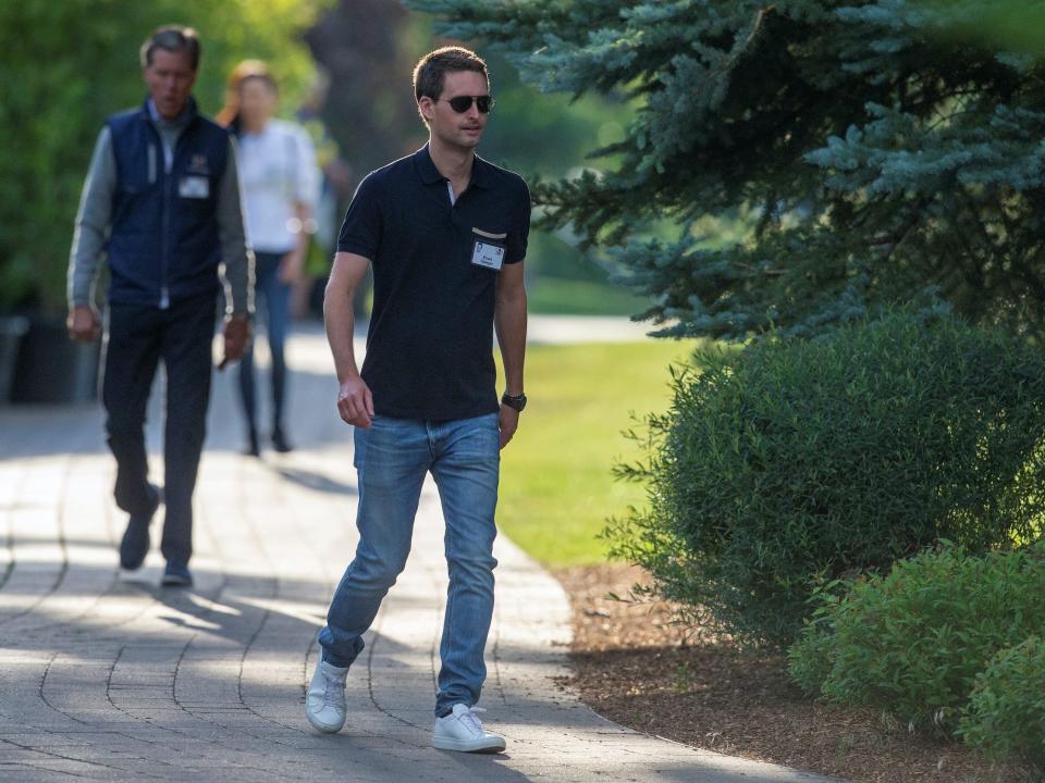 Evan Spiegel walks on a sidewalk at Sun Valley