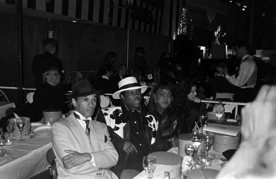 Rodgers (center), with musician August Darnell and guest during the “Love Ball” at New York’s Roseland Ballroom in 1989. - Credit: WWD,DNR,FN