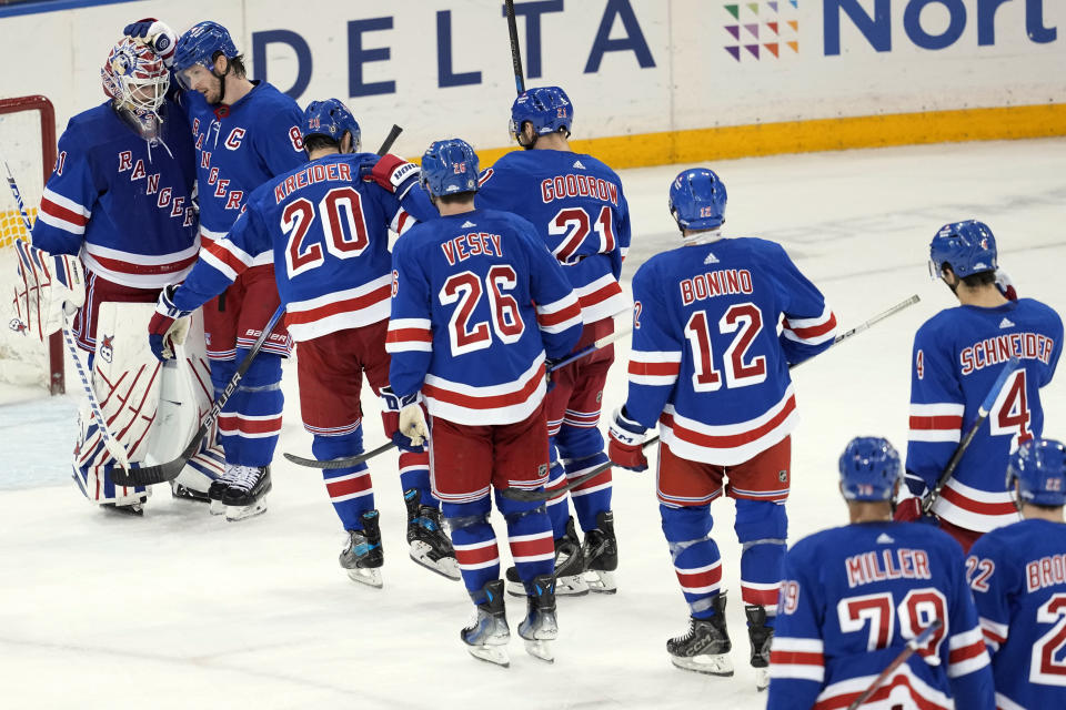 New York Rangers goaltender Igor Shesterkin (31) celebrates with his teammates after the New York Rangers defeated the Seattle Kraken during an NHL hockey game, Tuesday, Jan. 16, 2024, at Madison Square Garden in New York. (AP Photo/Mary Altaffer)