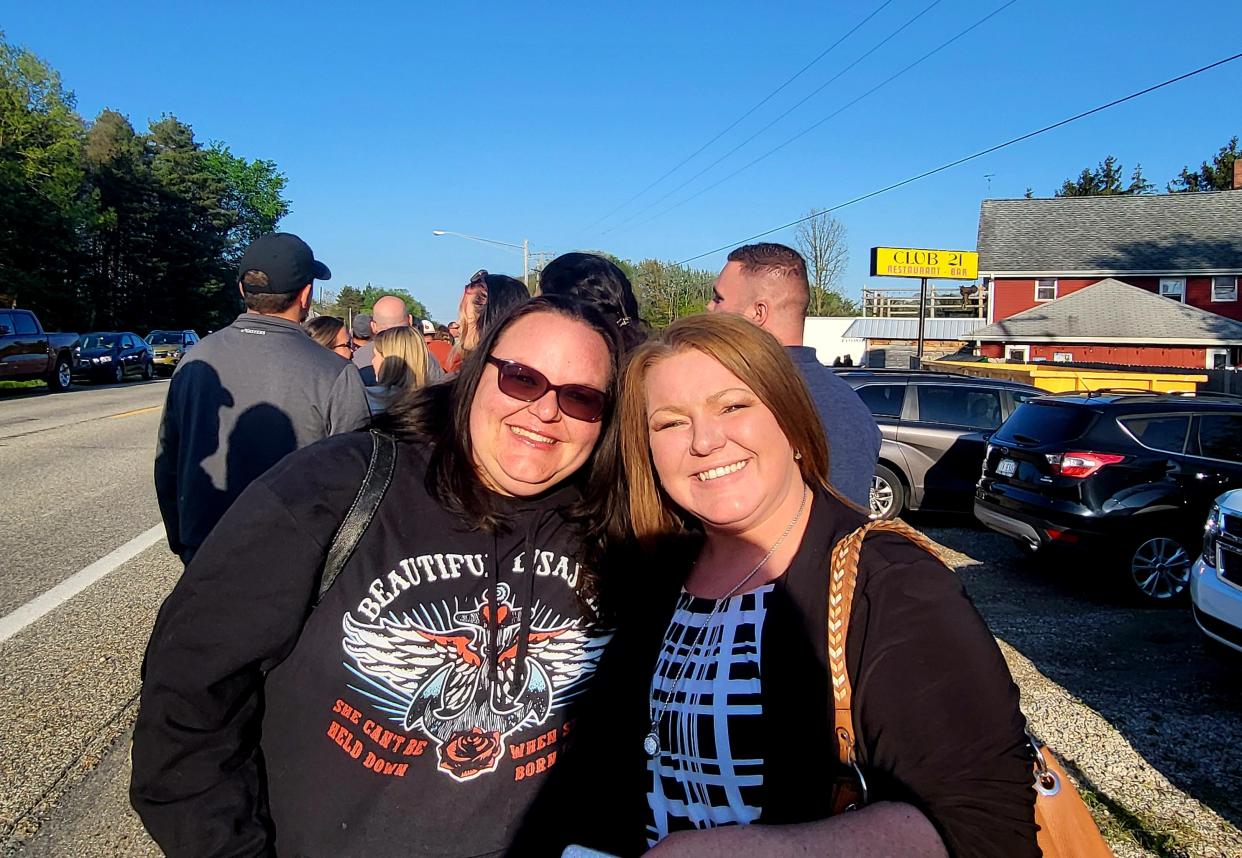 Jessica Hord, of Emmett, and Tina Bowen, of Capac, await in line on Wednesday, May 8, 2024, outside Club 21 in Goodells. Like others, they saw a promotional flyer on Facebook about a realty show, "Bar Rescue," filming at the establishment.