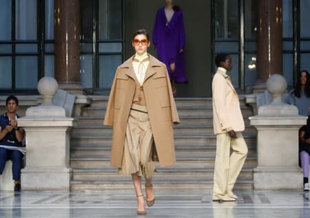 Models present creations during the Victoria Beckham catwalk show at London Fashion Week in London