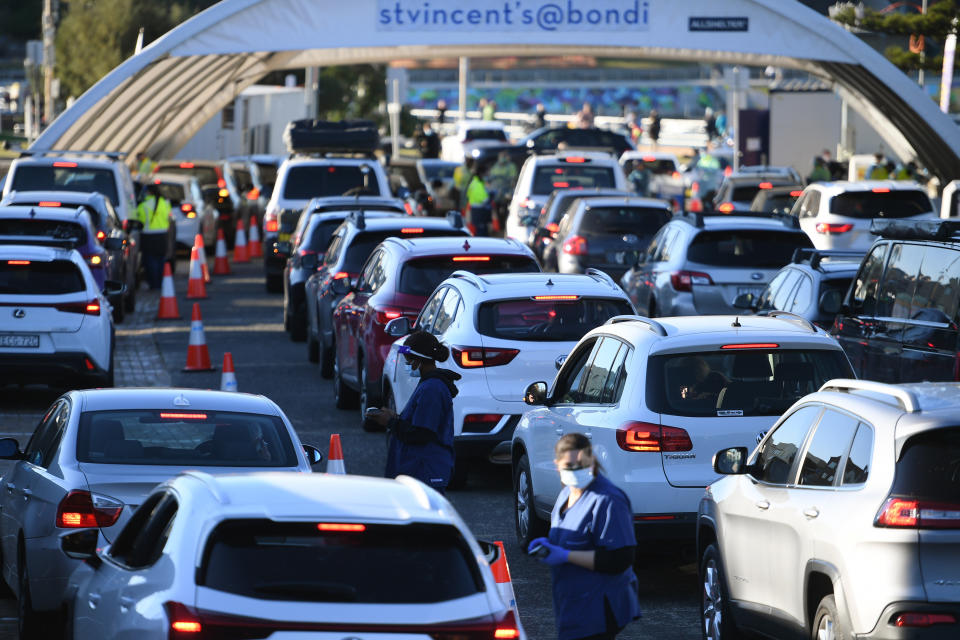 People queue in their cars to get tested for COVID-19 at a pop-up testing clinic at Bondi Beach in Sydney Friday, June 25, 2021. Parts of Sydney will go into lockdown late Friday after a coronavirus outbreak in Australia’s largest city continued to grow. (Dean Lewins/AAP Image via AP)