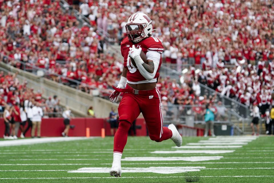 Wisconsin's Braelon Allen (0) runs for a touchdown during the first half of an NCAA college football game against the New Mexico State Saturday, Sept. 17, 2022, in Madison, Wis. (AP Photo/Morry Gash)