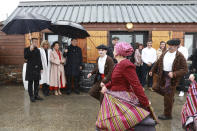 French President Emmanuel Macron and his wife Brigitte Macron, Chinese President Xi Jinping, and his wife Peng Liyuan watch folklore dancers, Tuesday, May 7, 2024 at the Tourmalet pass, in the Pyrenees mountains. French president is hosting China's leader at a remote mountain pass in the Pyrenees for private meetings, after a high-stakes state visit in Paris dominated by trade disputes and Russia's war in Ukraine. French President Emmanuel Macron made a point of inviting Chinese President Xi Jinping to the Tourmalet Pass near the Spanish border, where Macron spent time as a child visiting his grandmother. (AP Photo/Aurelien Morissard, Pool)