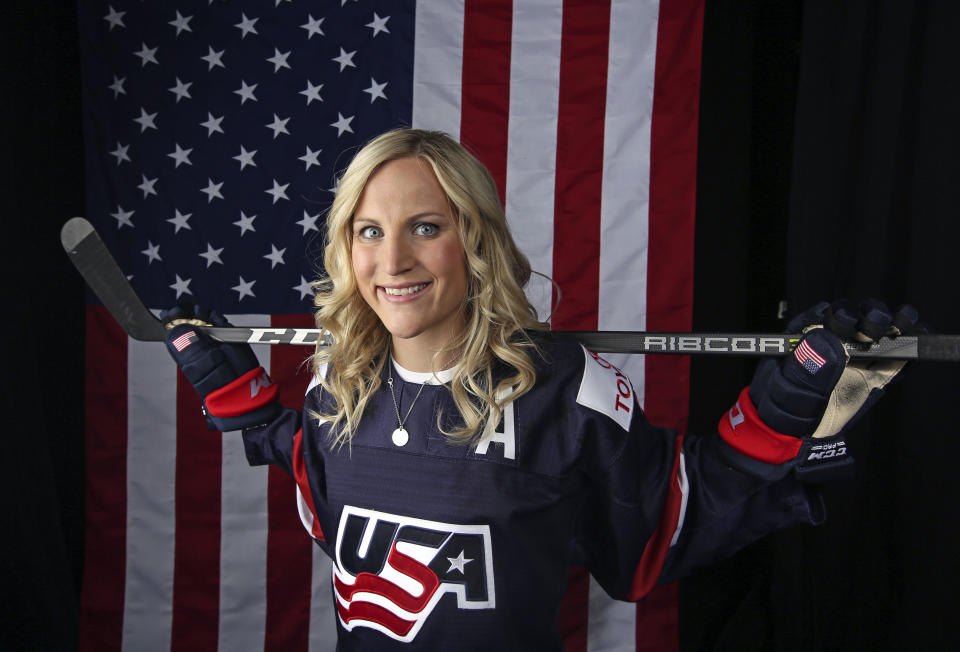 FILE - In this Sept. 26, 2017, file photo, United States women's hockey player Monique Lamoureux-Morando poses for a portrait at the 2017 Team USA Media Summit in Park City, Utah. Olympic women's hockey gold medalists Lamoureux-Morando and her sister Jocelyne Lamoureux-Davidson have unveiled their foundation that has a goal of benefiting underserved children and communities, primarily in their home state of North Dakota. The 30-year-old Grand Forks natives and University of North Dakota standouts helped the United States win the gold medal in South Korea in 2018. (AP Photo/Rick Bowmer, File)