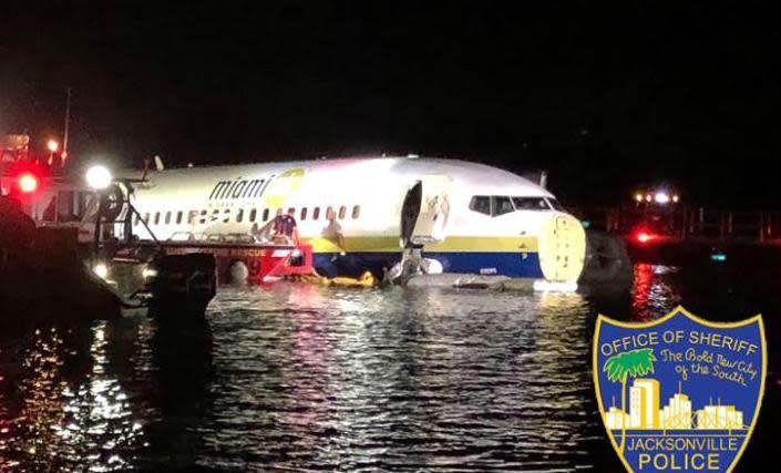 A large Boeing jet – flying from Guantanamo Bay and operated by the US government – has come down in a Florida river, triggering a widespread emergency response, but with all 136 people on board said to be alive and accounted for.Reports said the plane, operated by Miami Air International, a charter firm, had just landed at Naval Air Station Jacksonville, after flying from Guantanamo Bay. Images showed the jet – an older Boeing 737 rather than supermax model that has been involved in several fatal accidents – having skidded from the runway and ending up in the St Johns River.“We have a commercial plane down on the river. I’ve been briefed by our fire and rescue. They are on the scene. While they work please pray,” tweeted Jacksonville mayor Lenny Curry.“This is a developing situation. I’ve been briefed that all lives have been accounted for.”Reports said that while there were no fatalities, a number of people suffered injuries and were transferred to local hospitals Cheryl Borman, a defence lawyer from Chicago who has previously represented Walid bin Attash, a Yemeni terror suspect who has been held at the prison camp since 2004, told CNN the plane had been delayed four hours in departing the US naval base at Guantanamo Bay. When it landed, it did so amid lightening and thunder.“We went down with a bump, then it bounced, and swerved,” she said. “Then it came to a complete stop.”The naval air station, is located about eight miles south of Jacksonville, and is said to be regularly used for flight servicing the US’s military prison camp for terror suspects on at Cuba’s Guantanamo Bay.Images showed the jet sitting in the water, lit up with powerful lights.The St John’s River is the longest in Florida, and is very wide at the point it passes the Naval Air Station in Jacksonville.“[Our] marine unit was called to assist in reference to a commercial air plane in shallow water,” the Jacksonville sheriff’s office tweeted.> JSO Marine Unit was called to assist @NASJax_ in reference to a commercial airplane in shallow water. The plane was not submerged. Every person is alive and accounted for. pic.twitter.com/4n1Fyu5nTS> > — Jax Sheriff's Office (@JSOPIO) > > May 4, 2019“The plane was not submerged. Every person is alive and accounted for.”Boeing said it was aware of the incident and was seeking to gather additional information. WOKV-TV said that at least two people suffered minor injuries and that the plane was attempting to land during a heavy thunderstorm.A spokesman from the Naval Air Station Jacksonville said the plane had skidded off the runway at around 9pm EST. “Navy security and emergency response personnel are on the scene and monitoring the situation,” the spokesperson said.The aircraft was a Boeing 737-800 operated for the US Department of Defense by Miami Air International, a long-established charter firm.The 18-year-old plane had at one stage been flown by the UK airline XL Airways, until that company went bust in 2008.Earlier in the day, the aircraft had flown from Norfolk, Virginia to Jacksonville, and made the outbound flight to Guantanamo Bay. Departure was delayed by bad weather.While Donald Trump’s administration has cracked down on tourism to Cuba, flights between the US and the American military base on the island continue. Tickets on flights between Florida and Guantanamo Bay are straightforward to book. The American military base in Cuba occupies the two promontories at the mouth of Guantanamo Bay, along with the sea and the islets between them, covering a total area of 45 square miles. The USA has use of the base until 2033 under the terms of a lease signed in 1934.The complex includes two airstrips, docking for 40 ships and most of the amenities found in a small American town: a golf course and other sports facilities, cinemas, churches and the only McDonalds in Cuba.Additional reporting by agencies