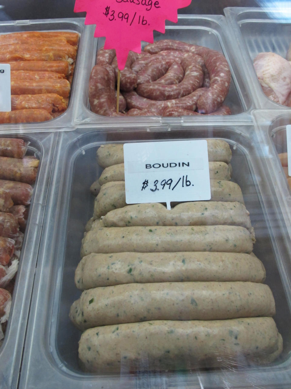 In this Monday, April 1, 2013 photo, Boudin, a pork and rice sausage popular in Louisiana, is seen in the cooler for sale at the Country Store market where it was made in Pennsdale, Pa. An influx of workers from the South to fill jobs in the natural gas industry in north-central Pennsylvania has led area catering businesses, restaurants and grocery stores to offer more Southern cuisine like jambalaya and boudin. (AP Photo/Genaro C. Armas)