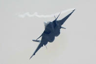 A J-20 stealth fighter jet of the Chinese People's Liberation Army (PLA) Air Force performs during the 13th China International Aviation and Aerospace Exhibition, also known as Airshow China 2021, on Tuesday, Sept. 28, 2021 in Zhuhai in southern China's Guangdong province. (AP Photo/Ng Han Guan)