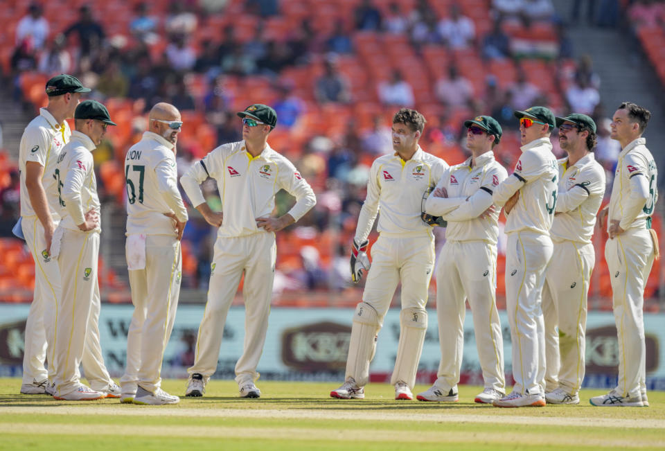 Australian players await a DRS review against India's Shubman Gill during the third day of the fourth cricket test match between India and Australia in Ahmedabad, India, Saturday, March 11, 2023. (AP Photo/Ajit Solanki)