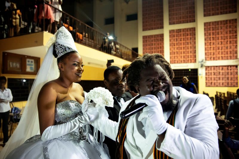 The Wider Image: Haiti's brides beat hurricanes, power cuts and protests to wed in style