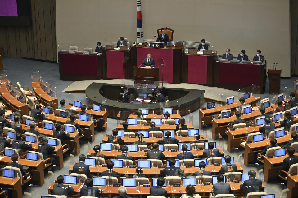 South Korea's President Moon Jae-in delivers a speech at the National Assembly in Seoul Monday, Oct. 25, 2021. Moon said Monday he’ll keep striving to promote peace with North Korea through dialogue until the end of his term next May, after Pyongyang raised animosities with a resumption of provocative weapons tests. (Jung Yeon-je/Pool Photo via AP)