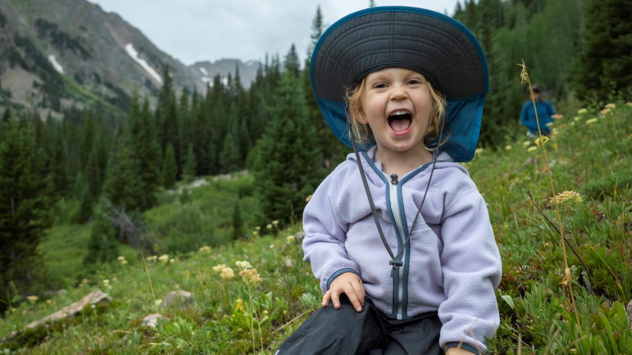  Young girl enjoying the mountains in the Wilderness, Colorado 