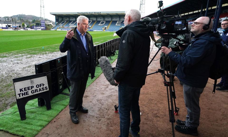 <span>Dundee secretary Eric Drysdale (left) speaks about the very wet Dens Park pitch before Wednesday’s postponement. </span><span>Photograph: Andrew Milligan/PA</span>