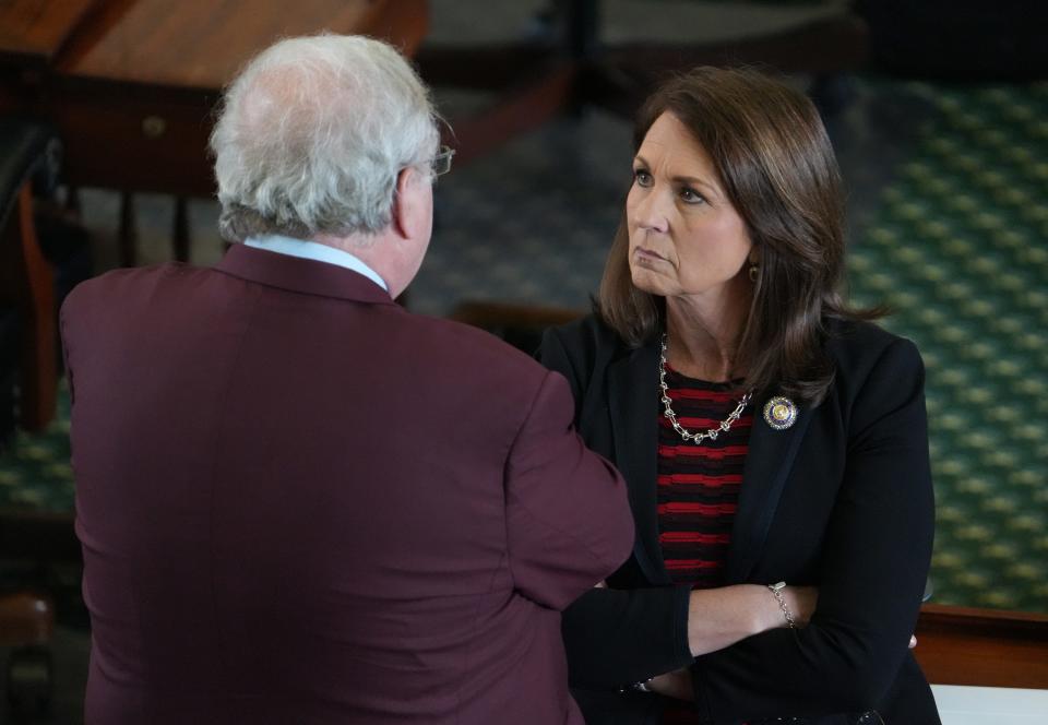 Sen. Angela Paxton, R - McKinney, talks to Sen. Paul Bettencourt, R - Houston, on the Senate Floor at the Capitol on Thursday May 25, 2023.  About two hours later, the House General Investigating Committee recommended articles of impeachment against her husband, Attorney General Ken Paxton.