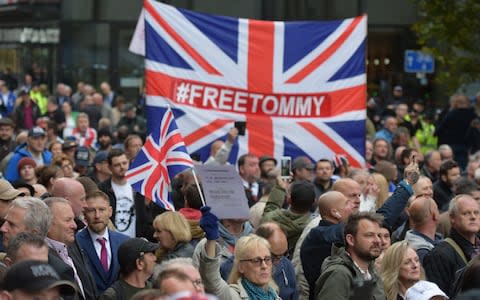 Hundreds of Tommy Robinson supporters line the streets  - Credit: The Telegraph/Geoff Pugh