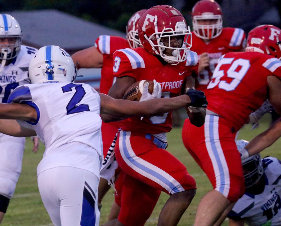 Frostproof running back Donavan Solomon bolts through a hole against Lakeland Christian on Friday night at Faris Brannen Stadium.