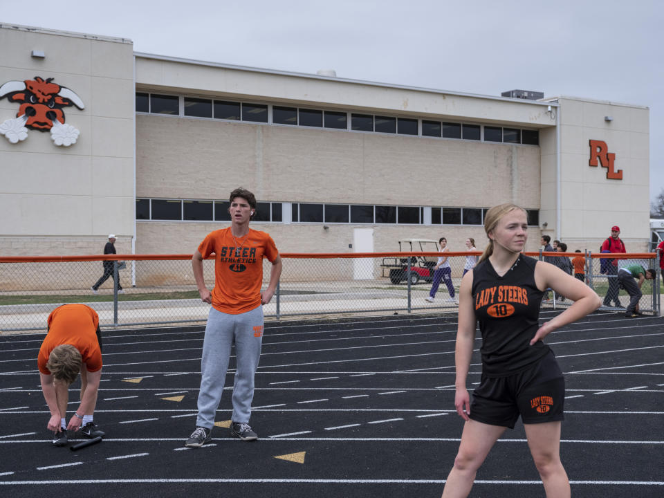 Members of Robert Lee ISD’s middle and high schools warm up before a track meet in Robert Lee, Texas on March 9, 2023. (Matthew Busch for NBC News)