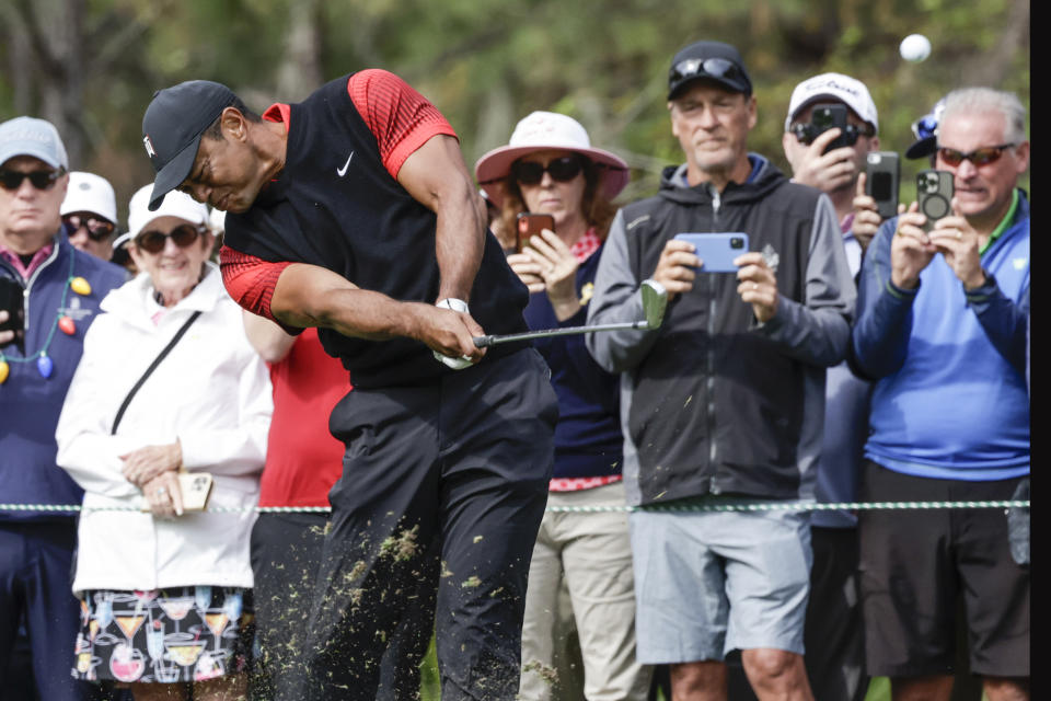Tiger Woods tees off on the 4th hole during the final round of the PNC Championship golf tournament Sunday, Dec. 18, 2022, in Orlando, Fla. (AP Photo/Kevin Kolczynski)