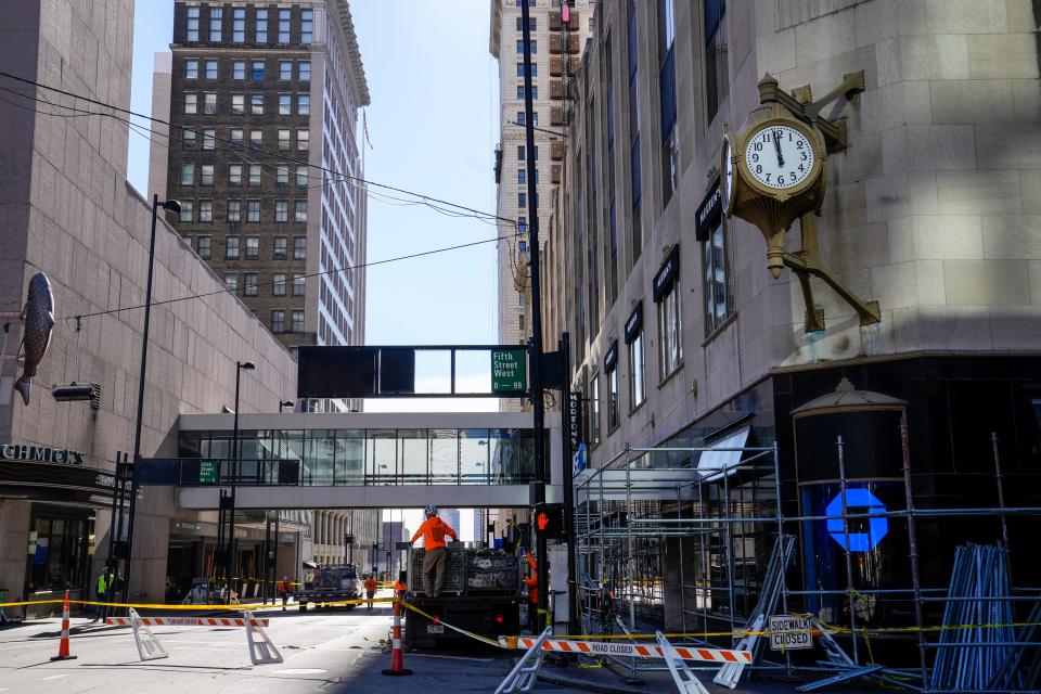 Vine Street at Fifth Street are closed as crews construct scaffolding around Carew Tower Tuesday, November 14, 2023. Bricks fell from the historic tower Monday, according to the Cincinnati Fire Department. No one was injured.