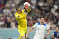 England's goalkeeper Jordan Pickford leaps for a save during the World Cup group B soccer match between England and The United States, at the Al Bayt Stadium in Al Khor , Qatar, Friday, Nov. 25, 2022. (AP Photo/Luca Bruno)