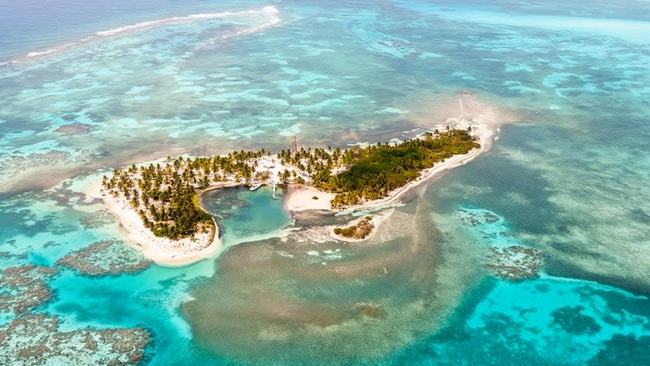 Aerial view of the small Lighthouse island (Key, Caye) of the coast of Belize, Lighthouse Atoll.