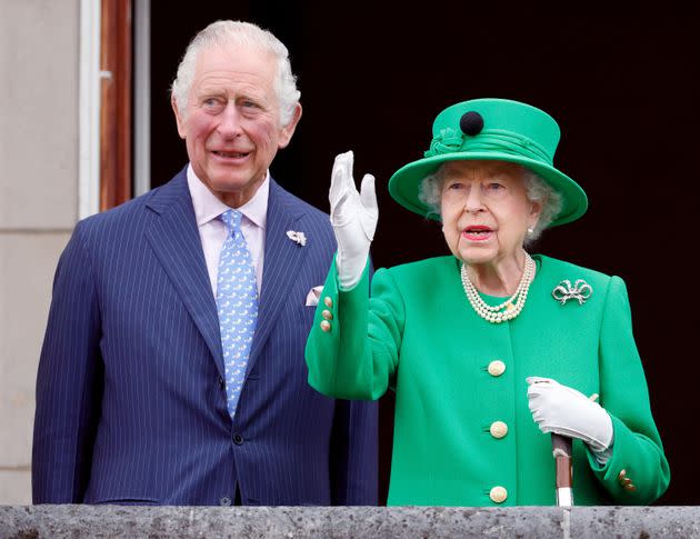 Prince Charles and Queen Elizabeth II stand on the balcony of Buckingham Palace following the Platinum Pageant on June 5 in London, (Photo: Max Mumby/Indigo via Getty Images)