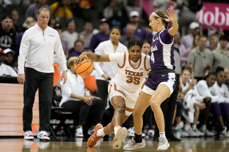 Texas forward Madison Booker (35) drives under pressure from Kansas State guard Serena Sundell (4) during the first half of an NCAA college basketball game Monday, March 11, 2024, in Kansas City, Mo. (AP Photo/Charlie Riedel)