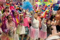 Some of the 30 child influencers invited by toy company Cepia LLC wave at an event held to launch its new fashion doll line called Decora Girlz, at an FAO Schwarz store on March 2, 2024 in New York. Cepia began investing in TikTok in 2019. (AP Photo/Anne D'Innocenzio)