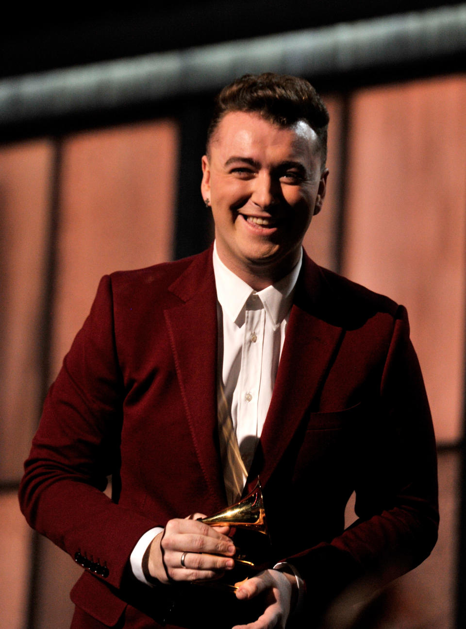 Sam Smith accepting their Grammy