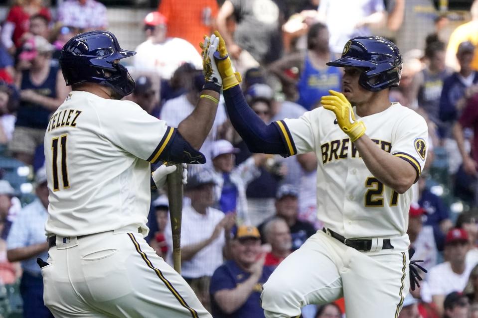Milwaukee Brewers' Willy Adames is congratulated by Rowdy Tellez after hitting a home run during the fifth inning of a baseball game against the St. Louis Cardinals Thursday, June 23, 2022, in Milwaukee. (AP Photo/Morry Gash)