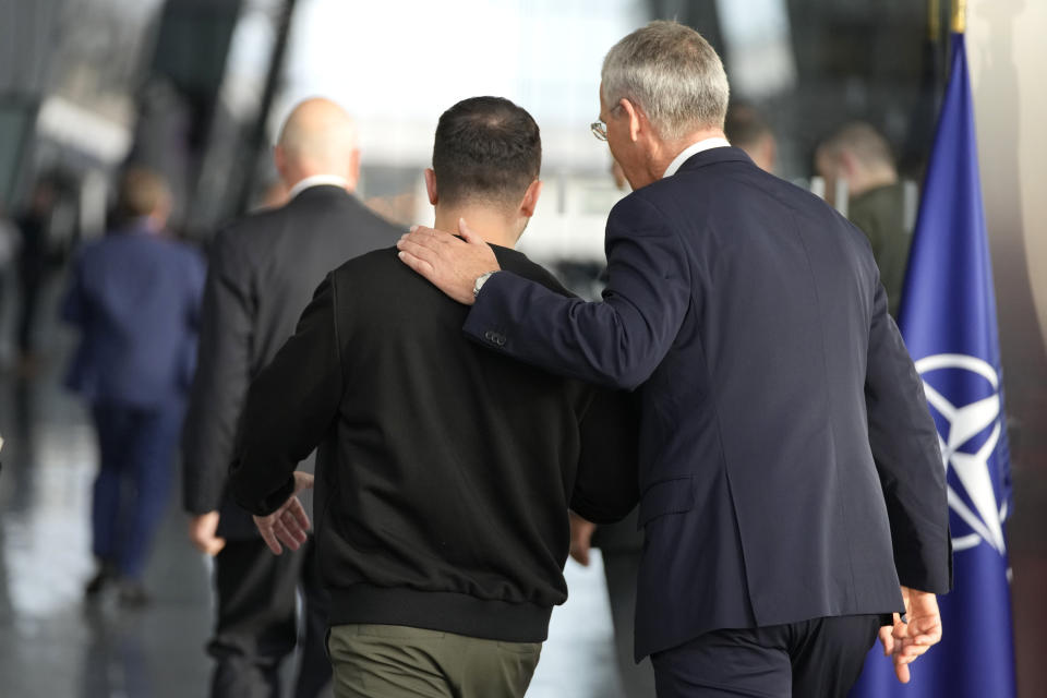 NATO Secretary General Jens Stoltenberg, right, speaks with Ukraine's President Volodymyr Zelenskyy after addressing a media conference prior to a meeting of NATO defense ministers at NATO headquarters in Brussels, Wednesday, Oct. 11, 2023. Ukraine's President Volodymyr Zelenskyy has arrived at NATO for meetings with alliance defense ministers to further drum up support for Ukraine's fight against Russia. (AP Photo/Virginia Mayo)