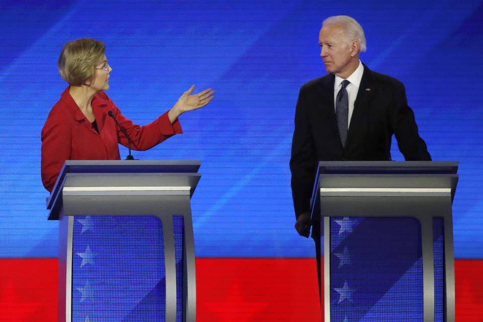 Sen. Elizabeth Warren, D-Mass., left, addresses former Vice President Joe Biden during a Democratic presidential primary debate on Feb. 7, 2020 in Manchester, N.H. (Elise Amendola/AP)                                                                                                                                                                                                                