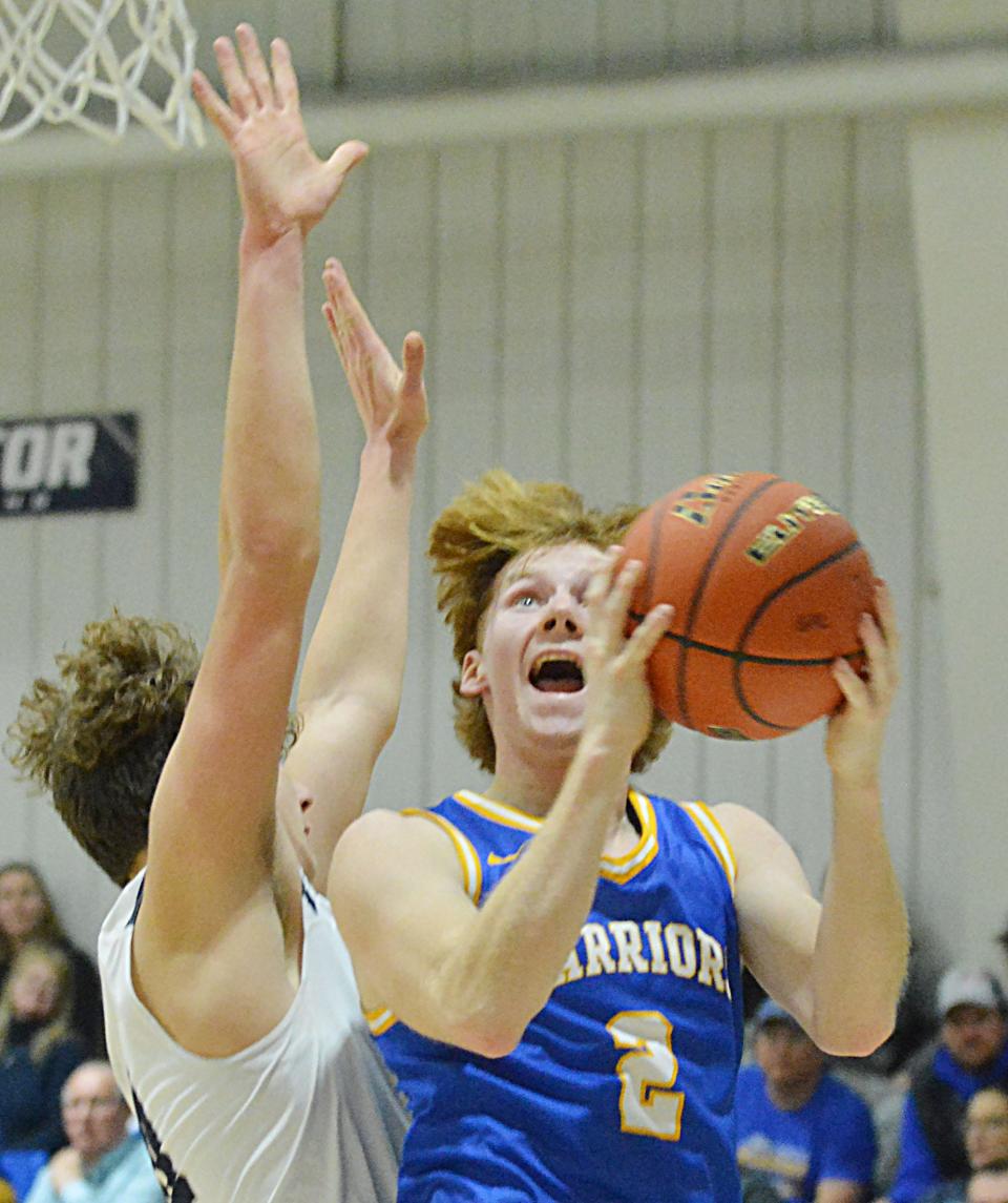 Castlewood's Lane Tvedt goes up for two against Great Plains Lutheran's Landon Czerwan during their high school boys basketball game on Thursday, Jan. 11, 2024 in Watertown. Top-rated Castlewood won 68-38.