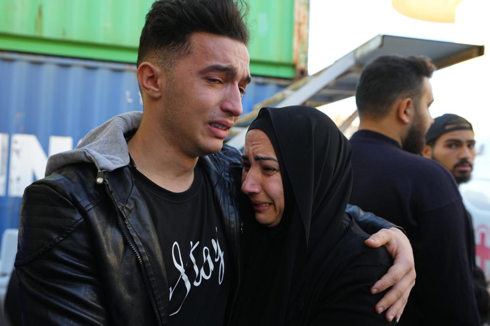 Relatives of a journalist of pan-Arab TV network Al-Mayadeen, who was killed by an Israeli strike, mourn at a hospital in Beirut, Lebanon, Tuesday, Nov. 21, 2023. An Israeli strike on southern Lebanon killed Tuesday two journalists reporting for the Beirut-based Al-Mayadeen TV on the violence along the border with Israel, according to the Lebanese information minister and their TV station. (AP Photo/Bilal Hussein)