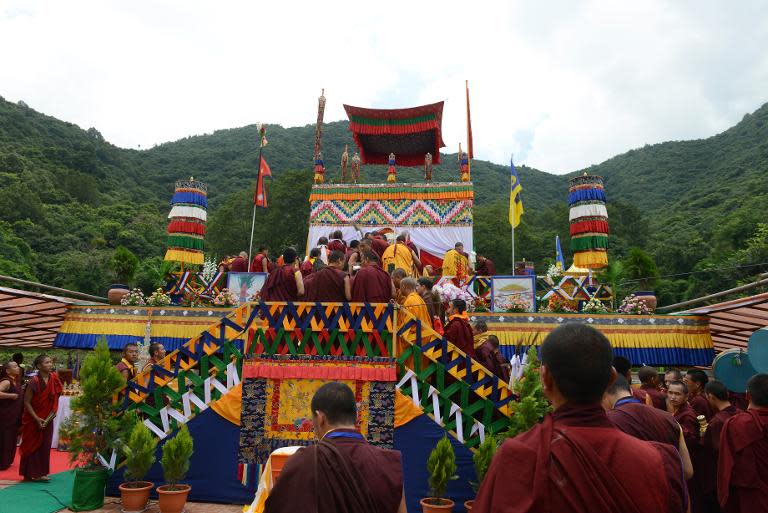 Buddhist monks attend the funeral of senior Tibetan Buddhist monk Shamar Rinpoche at Shar Minub monastery in Kathmandu on July 31, 2014