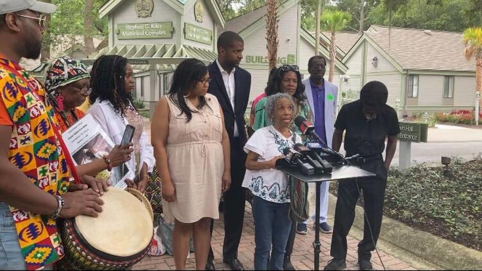 Josephine Wright speaks in front of Hilton Head town hall with Bakari Sellers (back row, center) in attendance. Photo by Blake Douglas