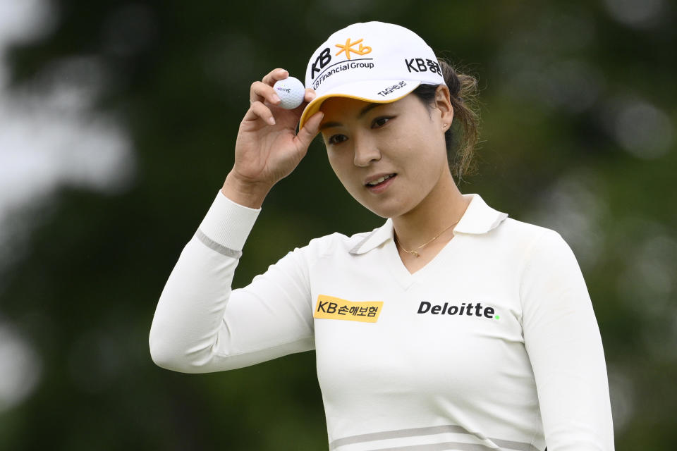 In Gee Chun, of South Korea, holds her ball after finishing her round on the ninth hole during the first round in the Women's PGA Championship golf tournament at Congressional Country Club, Thursday, June 23, 2022, in Bethesda, Md. (AP Photo/Nick Wass)