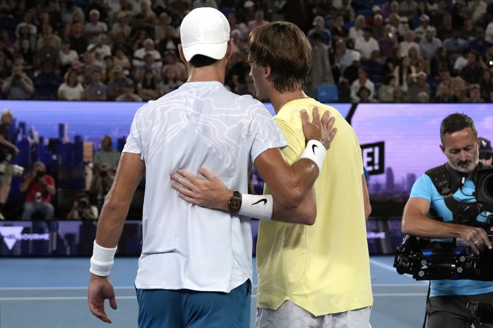 Karen Khachanov, left, of Russia consoles Sebastian Korda of the U.S. after Korda withdrew from their quarterfinal match with an injured wrist at the Australian Open tennis championship in Melbourne, Australia, Tuesday, Jan. 24, 2023 (AP Photo/Ng Han Guan)