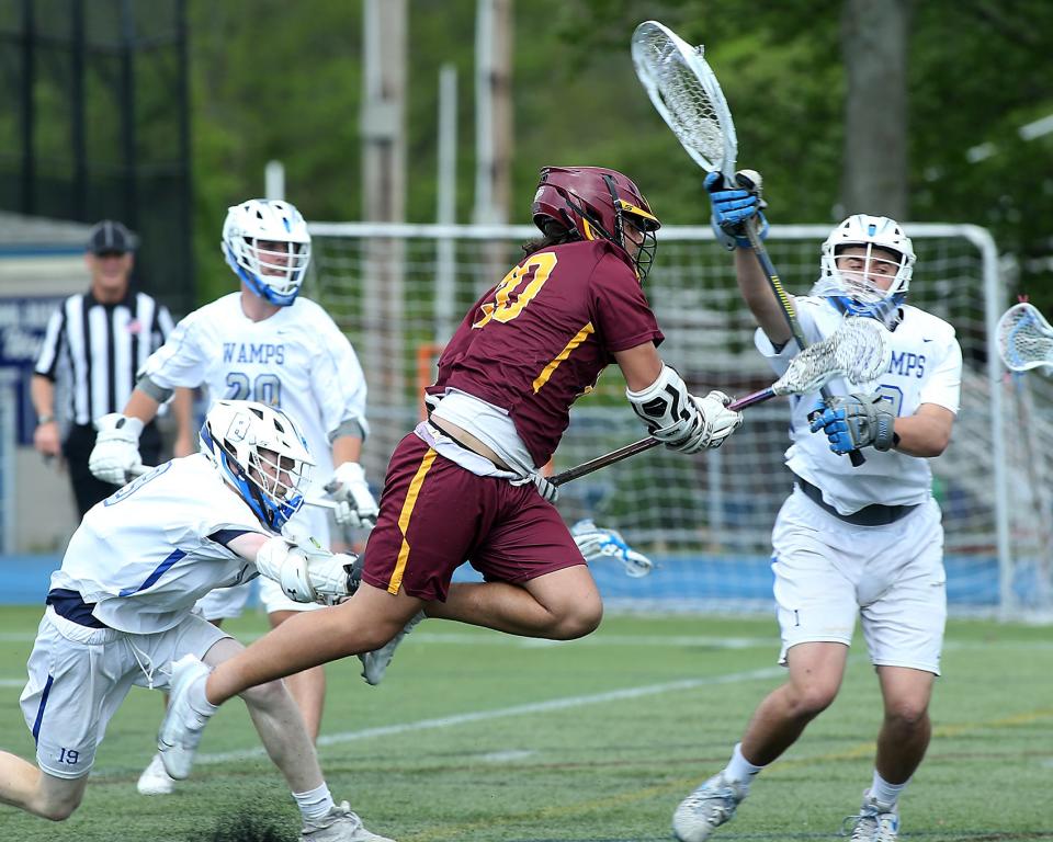 Weymouth's Mike Stevenson comes flying in to score a goal to give Weymouth the 4-3 advantage over Braintree during first quarter action of their game at Braintree High on Tuesday, May 17, 2022.