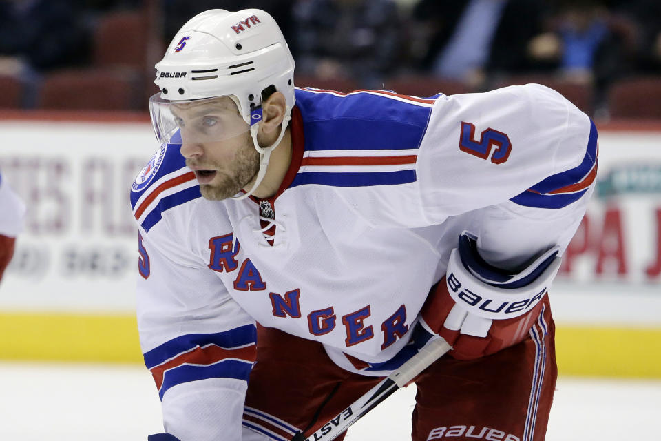 FILE - In this Dec. 29, 2016, file photo, New York Rangers defenseman Dan Girardi (5) gets set for a faceoff during the first period during an NHL hockey game against the Arizona Coyotes in Glendale, Ariz. The former New York Rangers and Tampa Bay Lightning defenseman has announced his retirement from the NHL after 13 seasons on Friday, Sept. 20, 2019. (AP Photo/Rick Scuteri, File)